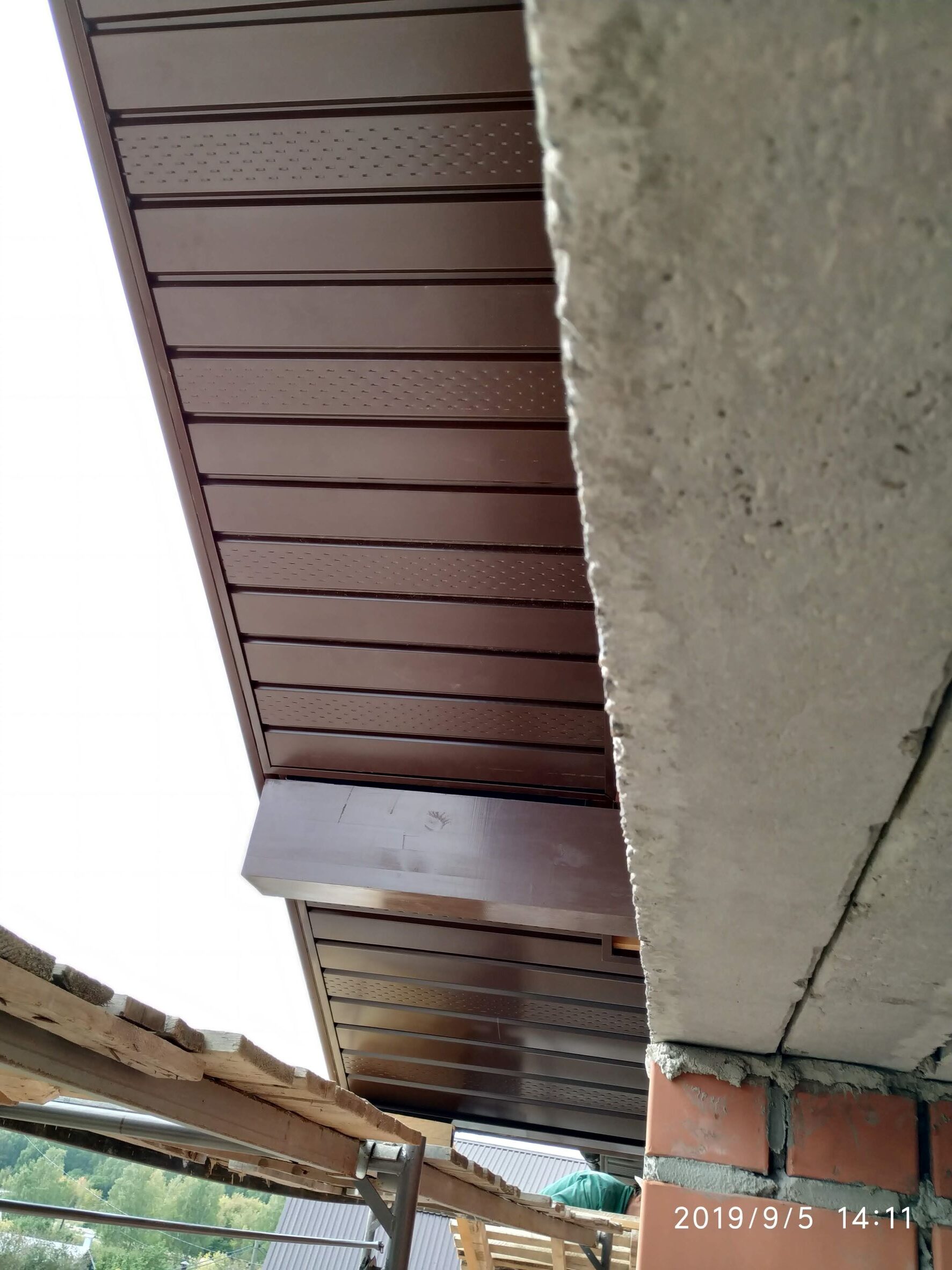 The bottom of the eaves is made of metal siding.